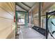 Washer and dryer set in screened laundry area leading to backyard and storage shed at 1434 Se Silver Springs Pl, Ocala, FL 34471