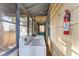 Washer and dryer in screened room with view of the exterior house siding and backyard at 1434 Se Silver Springs Pl, Ocala, FL 34471