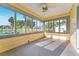 Bright sunroom with expansive windows offering plenty of natural light and outdoor views at 1434 Se Silver Springs Pl, Ocala, FL 34471