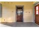 Enclosed porch featuring natural light, wood floors and a vintage door at 1434 Se Silver Springs Pl, Ocala, FL 34471