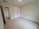 Carpeted bedroom with closet at 15055 Sw 25Th Cir, Ocala, FL 34473
