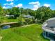Backyard view with canal access, fenced yard, and an elevated deck with scenic views at 15621 Se 103Rd Ter, Summerfield, FL 34491
