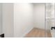 Walk-in closet features a shelving system to help maximize storage and organization; has wood-look floors at 15621 Se 103Rd Ter, Summerfield, FL 34491