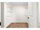Walk-in closet with white wire shelving and neutral carpeting at 15621 Se 103Rd Ter, Summerfield, FL 34491