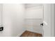 Walk-in closet with white wire shelving and neutral carpeting at 15621 Se 103Rd Ter, Summerfield, FL 34491