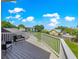 Deck view showcasing seating and a lush backyard, perfect for relaxing or entertaining guests at 15621 Se 103Rd Ter, Summerfield, FL 34491