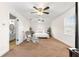 Main bedroom features neutral tones, two ceiling fans, and natural light at 15621 Se 103Rd Ter, Summerfield, FL 34491