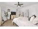 Primary bedroom featuring wood floors, a large TV, and a large walk-in closet at 1814 Nw 44 Court Rd, Ocala, FL 34482