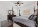 Bedroom features dark wood furniture, a neutral wall color, and carpet flooring at 1814 Nw 44 Court Rd, Ocala, FL 34482