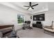 Bonus room featuring modern furniture, a large TV, and natural light from the window at 1814 Nw 44 Court Rd, Ocala, FL 34482