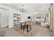 Open-concept dining area with stylish lighting and decor, connecting seamlessly to the kitchen and living spaces at 1814 Nw 44 Court Rd, Ocala, FL 34482