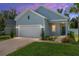 Charming one-story home boasts a brick driveway, two-car garage, and lovely landscaping, perfect for curb appeal at 1814 Nw 44 Court Rd, Ocala, FL 34482