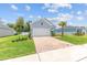 Charming home featuring a paver driveway, well-maintained lawn, and inviting curb appeal at 1814 Nw 44 Court Rd, Ocala, FL 34482