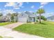 Beautiful home with lush landscaping, a paver driveway, and charming curb appeal at 1814 Nw 44 Court Rd, Ocala, FL 34482