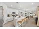 Bright, modern kitchen features a large island with seating, stainless steel appliances, and an open floor plan at 1814 Nw 44 Court Rd, Ocala, FL 34482