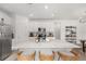 Bright, modern kitchen features a large island with seating, stainless steel appliances, and an open floor plan at 1814 Nw 44 Court Rd, Ocala, FL 34482