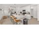 Bright, modern kitchen features a large island with seating, stainless steel appliances, and an open floor plan at 1814 Nw 44 Court Rd, Ocala, FL 34482