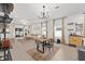 Open-concept living and dining area features stylish bar and sliding glass doors to the outside at 1814 Nw 44 Court Rd, Ocala, FL 34482