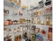 Organized pantry with wire shelves stocked with food items and household supplies at 1814 Nw 44 Court Rd, Ocala, FL 34482