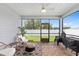Relaxing screened patio with brick floors and outdoor seating, ideal for entertaining at 1814 Nw 44 Court Rd, Ocala, FL 34482
