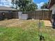 Large, private backyard featuring a storage shed and wooden fencing, perfect for outdoor activities at 21511 Sw Plantation Sw St, Dunnellon, FL 34431
