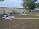 Large, well-maintained backyard featuring patio seating, garden decor, and ample space for activities at 21511 Sw Plantation Sw St, Dunnellon, FL 34431