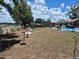 Expansive backyard with pool, gazebo, seating, and greenery, perfect for outdoor living and entertaining at 21511 Sw Plantation Sw St, Dunnellon, FL 34431