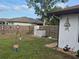Spacious backyard with a well-maintained lawn and privacy fence, featuring a convenient storage shed at 21511 Sw Plantation Sw St, Dunnellon, FL 34431