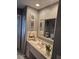 Bathroom vanity with neutral colors, patterned towels, and art on the walls at 21511 Sw Plantation Sw St, Dunnellon, FL 34431