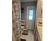 Bathroom with white tile, patterned shower curtain, toilet, and vanity with towel rack at 21511 Sw Plantation Sw St, Dunnellon, FL 34431