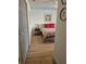 The bedroom's layout displays cozy furnishings and natural light, viewed from the doorway at 21511 Sw Plantation Sw St, Dunnellon, FL 34431