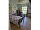 The bedroom offers cozy furnishings and bright natural light from the exterior window at 21511 Sw Plantation Sw St, Dunnellon, FL 34431