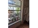 Bedroom window with backyard full of potted plants and a pool in the patio at 21511 Sw Plantation Sw St, Dunnellon, FL 34431