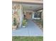 Inviting front porch with double doors, decorated with seasonal wreath, and decorative plants at 21511 Sw Plantation Sw St, Dunnellon, FL 34431
