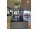 This modern kitchen features a large island and an exterior view to the back yard at 21511 Sw Plantation Sw St, Dunnellon, FL 34431