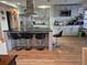 Modern kitchen design with stainless steel appliances, a large island, and barstool seating at 21511 Sw Plantation Sw St, Dunnellon, FL 34431