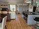 Open concept living room and kitchen, hardwood floors, decorated with eagle statue at 21511 Sw Plantation Sw St, Dunnellon, FL 34431