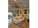 The living room features a cozy white sofa, adjacent dining area and attractive decor at 21511 Sw Plantation Sw St, Dunnellon, FL 34431