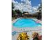 Sparkling pool featuring a soothing fountain, pink flamingo floaties, and a charming gazebo for poolside relaxation at 21511 Sw Plantation Sw St, Dunnellon, FL 34431