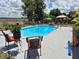 Enjoy the sparkling pool, complete with fun flamingo floaties and a charming gazebo for relaxing poolside at 21511 Sw Plantation Sw St, Dunnellon, FL 34431