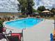 Enjoy the sparkling pool, complete with a soothing fountain and a charming gazebo for relaxing poolside at 21511 Sw Plantation Sw St, Dunnellon, FL 34431