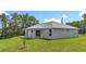 A well-manicured lawn complements the home's exterior, creating a peaceful and inviting backyard space at 226 Locust Ln, Ocala, FL 34472