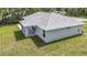 A neatly maintained lawn and covered patio create a serene and private backyard retreat at 226 Locust Ln, Ocala, FL 34472