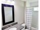 A full bathroom features a shower with white subway tile and a vanity with granite counters at 226 Locust Ln, Ocala, FL 34472