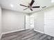 Comfortable bedroom with ceiling fan and a view into the hallway at 226 Locust Ln, Ocala, FL 34472