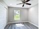 Bedroom with a window looking out onto the front yard at 226 Locust Ln, Ocala, FL 34472