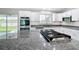 Bright kitchen featuring granite countertops and a center island cooktop at 226 Locust Ln, Ocala, FL 34472