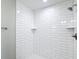 Bathroom shower featuring white subway tile, a corner shelf, modern shower head and faucet hardware at 226 Locust Ln, Ocala, FL 34472