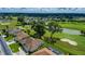 Beautiful aerial view of a golf community with houses, a pond, and mature trees at 2515 Nw 53 Ave, Ocala, FL 34482