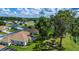 Aerial shot of golf community homes with beautiful landscaping and mature trees in a scenic setting at 2515 Nw 53 Ave, Ocala, FL 34482